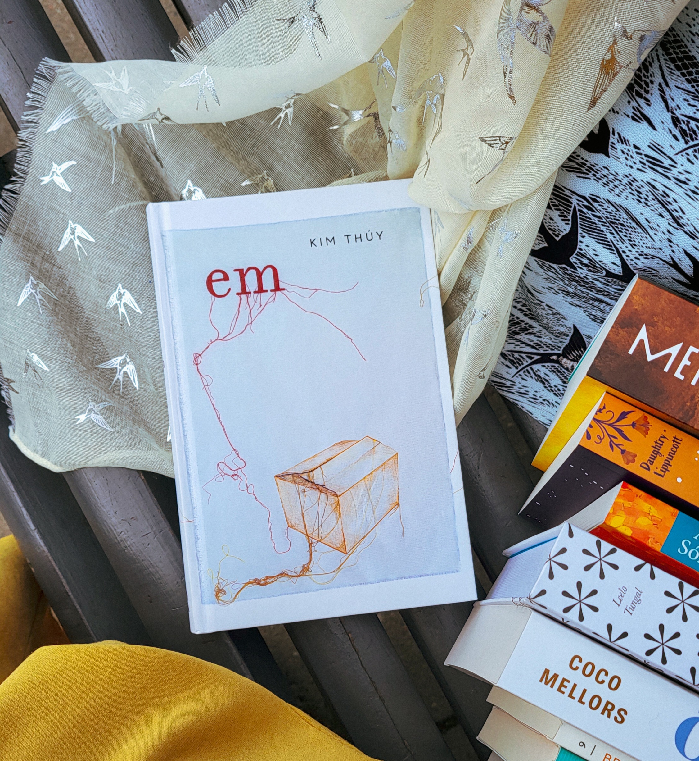 Em